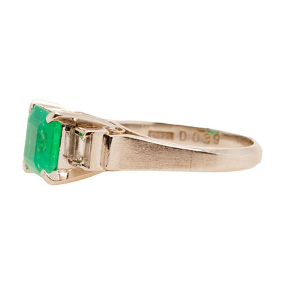 Platinum Princess Shaped Emerald With Side Diamonds Ring