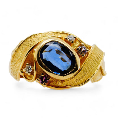 18K Gold Bezel Set Blue Sapphire With Diamond Accents And Leaf Motif Ring