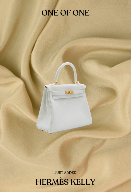 a white Hermes Kelly bag with caption: "one of one. Just added Hermes Kelly"